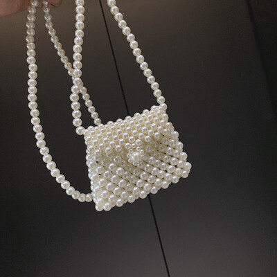 Qiao Bani 2019 new Korean Bohemian fashion handmade pearls hand strap shoulder diagonal trend handbags
Qiao Bani 2019 new Korean Bohemian fashion handmade pearls hand strap shoulder diagonal trend handbags