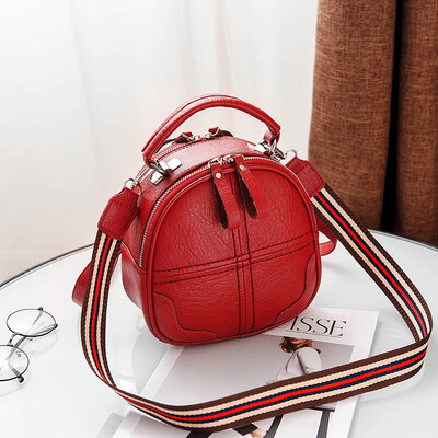 A girl with a double shoulder bag a broadband shoulder bag a Korean version of a backpack a girl slanted a small round bag and
A girl with a double shoulder bag a broadband shoulder bag a Korean version of a backpack a girl slanted a small round bag and