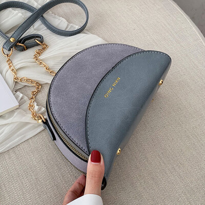 One shoulder slanted small bag double zipper 2019 Korean version of the new fashion semicircular bag hit color chain small bag tid
One shoulder slanted small bag double zipper 2019 Korean version of the new fashion semicircular bag hit color chain small bag tid