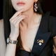Flying flower brooch fixed clothes Korean version simple pearl brooch corsage women's accessories anti-light buckle all-match silk scarf buckle bow style gold Flying flower brooch fixed clothes Korean version simple pearl brooch corsage women's accessories anti-light buckle all-match silk scarf buckle bow style gold