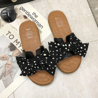 

Slipper female summer wear beach holiday slippers net red 2019 new Korean leopard bow soft bottom drag