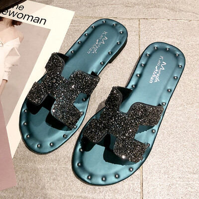 

Korean version wearing h slippers outside spring fashion water drill ins harbor wind flat bottom one-word sandy beach slipper