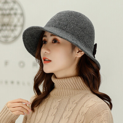 

Autumn&winter new 100 sets of warm knitted wool cap Wool ladies Korean version after opening bow bow pure color pot cap