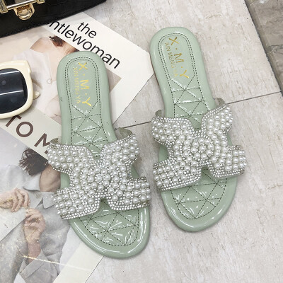 

Slipper womens summer fashion wear tide net red 2019 new Korean version of H-Pearl flat ins tide sandals toe dew