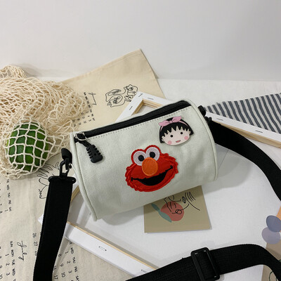 

Casual fashion ugly sesame street canvas cylinder bag female 2019 new cartoon simple versatile shoulder Messenger bag