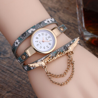 

New broken pattern ladies winding fine strap watch female models fashion wings pendant quartz watch