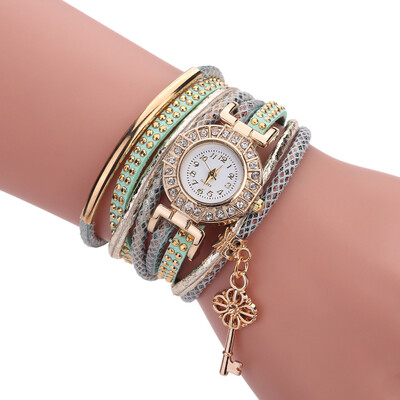 

Creative fashion ladies winding bracelet watch gold key pendant quartz watch female models explosion models