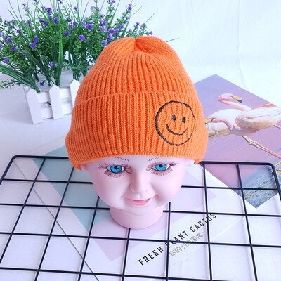 

Childrens wool hats Korea autumn&winter new warm smiling face knit cap head cap boys&girls baby hat candy