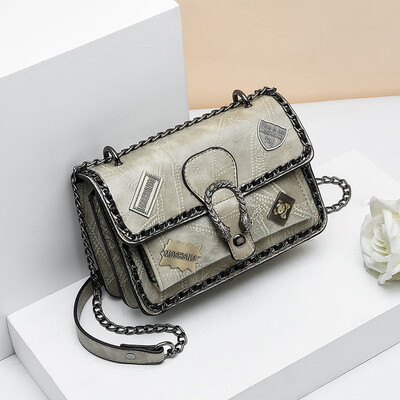 

Retro spring&summer tide woman hand-held retro badge 100 lap rivets chain single shoulder oblique satchel bag