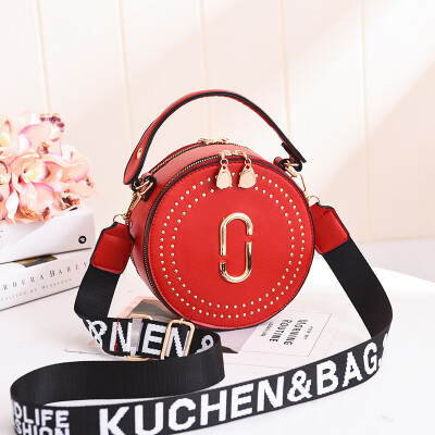 

Fashion rivet small round bag portable Korean version of the lady bag shoulder diagonal wide shoulder strap small bag