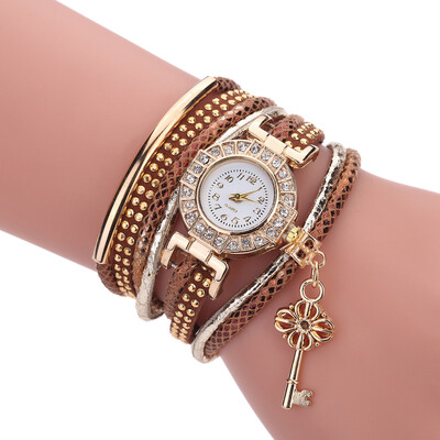 

Creative fashion ladies winding bracelet watch gold key pendant quartz watch female models explosion models