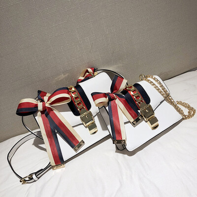 

Qiao Bani 2019 new South Korea ins star catwalk ribbon hit color flip bag shoulder slant diagonal trend handbags