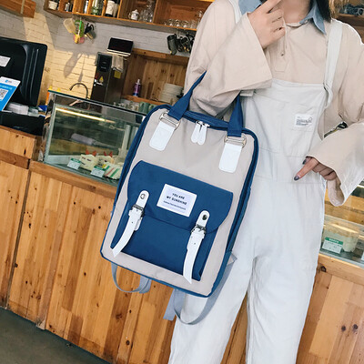 

Large-capacity school bag female 2019 new Korean version of the fashion contrast color casual canvas bag wild campus backpack