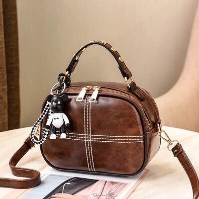 

The Korean version of Shangxin Womens Bag Chao Baitao oblique small round bag retro fashion ladys one-shoulder bag
