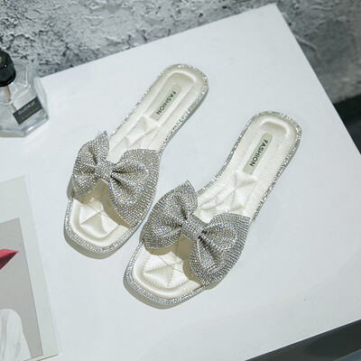 

Fashion rhinestone bow slippers women wear 2019 summer new Korean version of Joker net red flat-bottomed pregnant women sandals ti