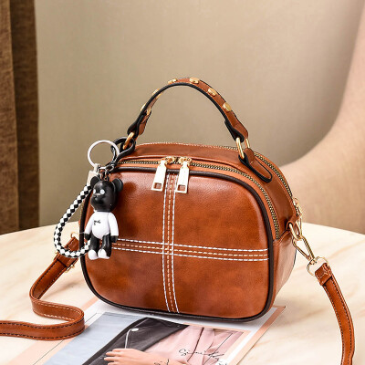 

The Korean version of Shangxin Womens Bag Chao Baitao oblique small round bag retro fashion ladys one-shoulder bag