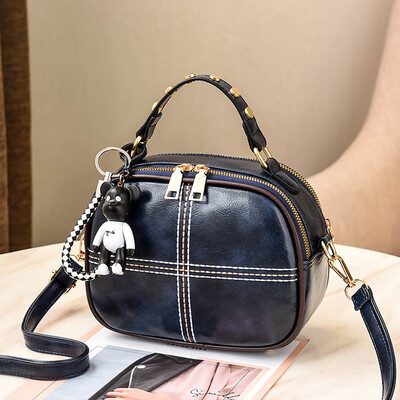 

The Korean version of Shangxin Womens Bag Chao Baitao oblique small round bag retro fashion ladys one-shoulder bag