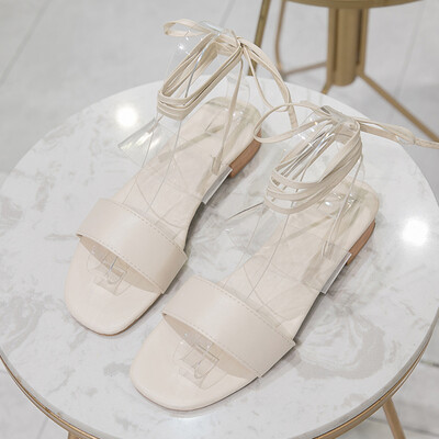 

Sandals women wear Korean version of open-toed cross-tie Roman shoes flat-bottomed simple beach sandals tide