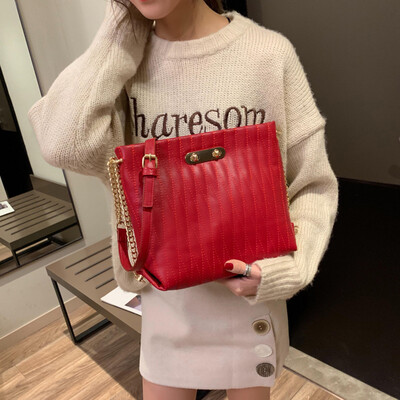 

Qiao Bani 2019 new European&American style fashion simple solid color embroidery line lock single shoulder diagonal trend handbags wholesale