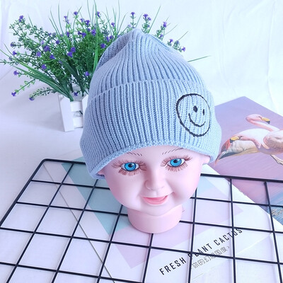 

Childrens wool hats Korea autumn&winter new warm smiling face knit cap head cap boys&girls baby hat candy