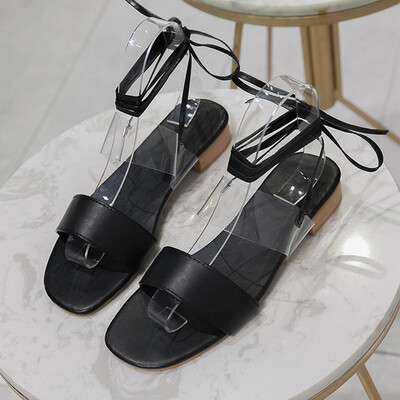 

Sandals women wear Korean version of open-toed cross-tie Roman shoes flat-bottomed simple beach sandals tide