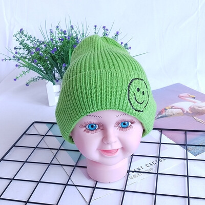

Childrens wool hats Korea autumn&winter new warm smiling face knit cap head cap boys&girls baby hat candy