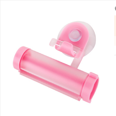 

Cntomlv 1 PCS Creative Rolling Squeezer Toothpaste Dispenser Tube Partner Sucker Hanging Holde distributeur dentifrice