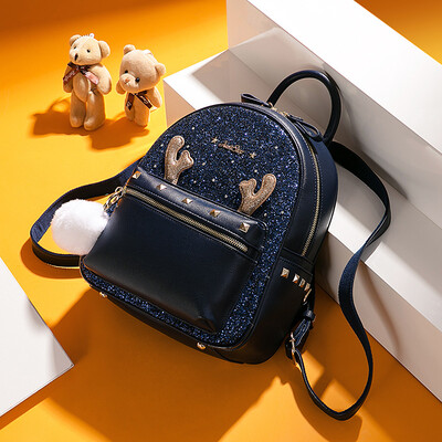 

Ou Shina JUST STAR handbags sequins collage travel backpack Korean version of the ball hanging ornaments student backpack female 552 dark blue