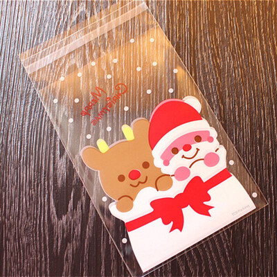

UpperX 100Pcs Candy Bags Cute Sachet Bag Pattern of Santa Claus Bag Pouch for Candy Biscuit Chocolate Candy Sweets Candy Gift Bags