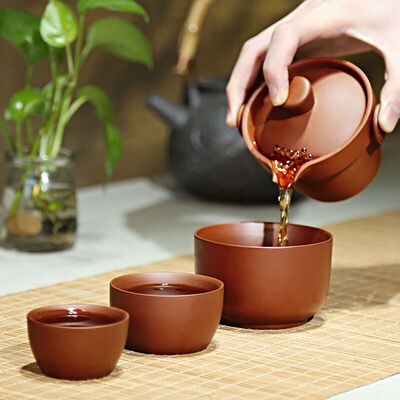 

Artistic fast cups of purple tea with a pot of a bottle of rhyme fast guest cup