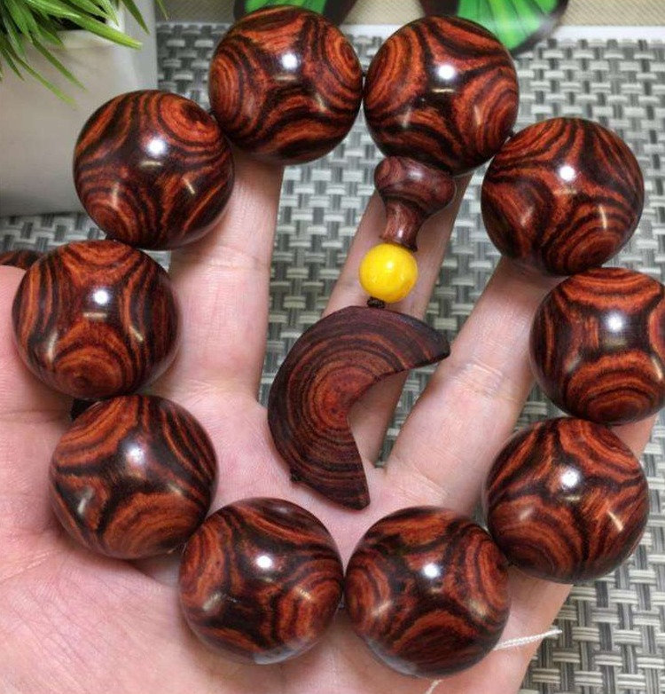 取芯鬼脸纹25mm10颗商品名称:海南黄花梨手串2