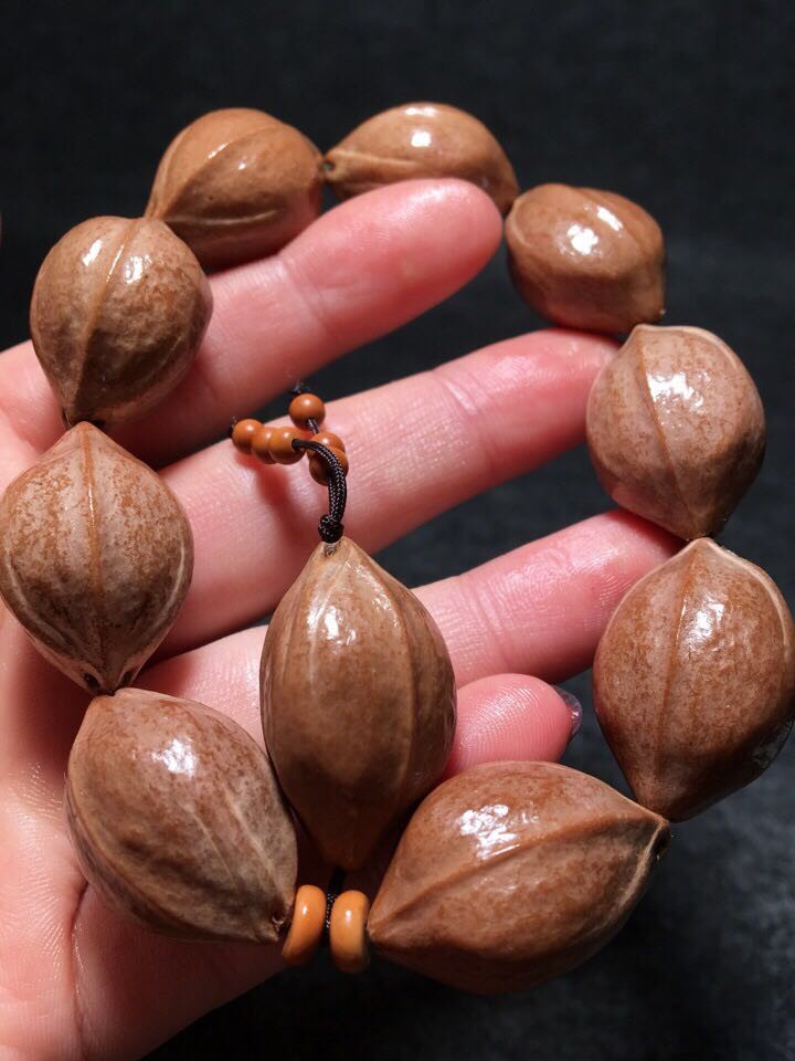 思赞橄榄核雕梅林铁核手串素串图片色