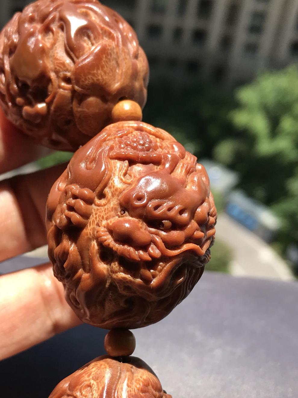 文玩手串男款橄榄核雕刻九龙献瑞手持印尼橄榄核手工雕刻九龙【图片