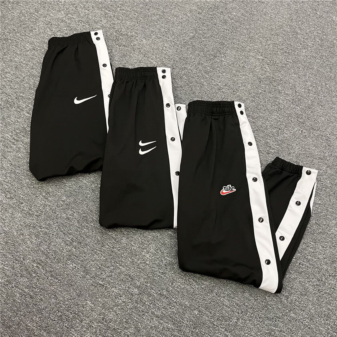 夏花纸马腾迅体育旗舰官方店nba男子排扣裤全开宽松运动裤长裤刺绣