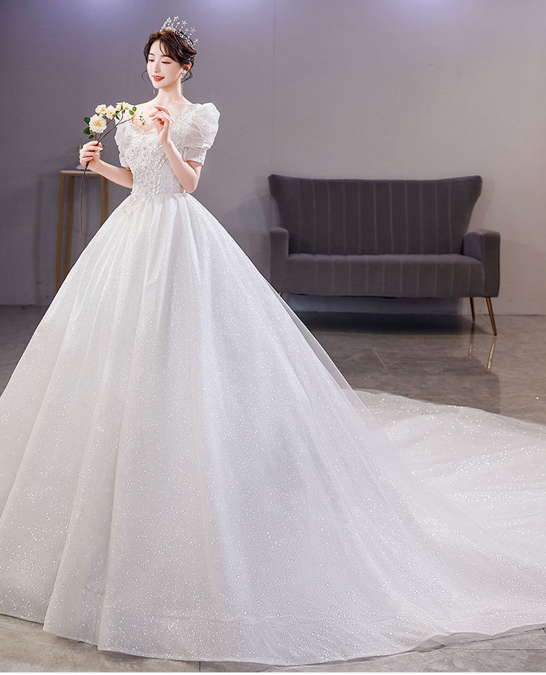 款式:深v款袖型:其他流行元素:钉珠风格:甜美风婚纱摆型:小拖尾领型