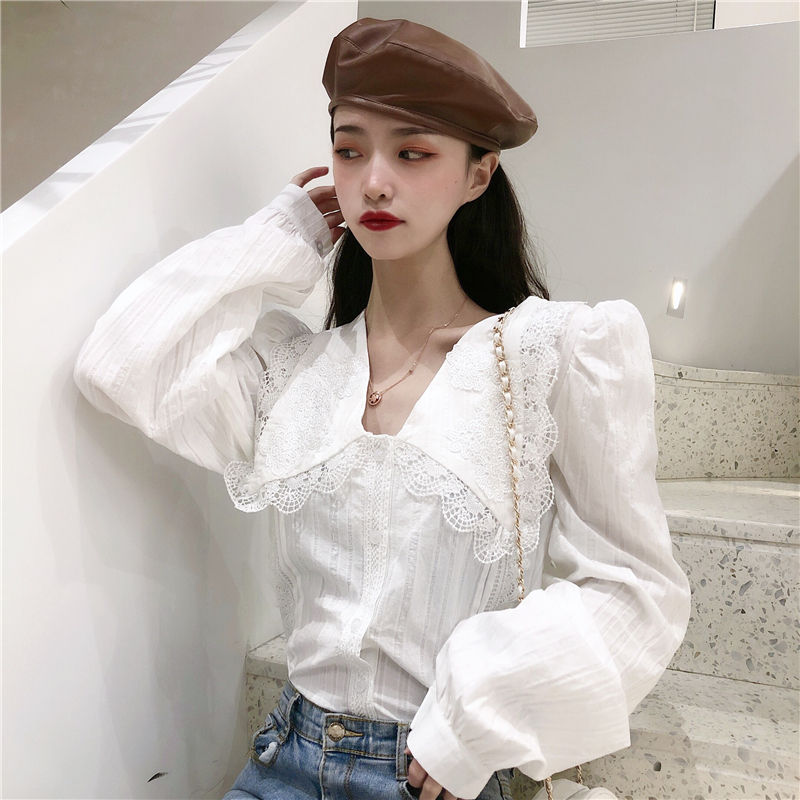 2020新款复古法式蕾丝拼接翻领设计感单排扣泡泡袖衬衫女秋冬款内搭