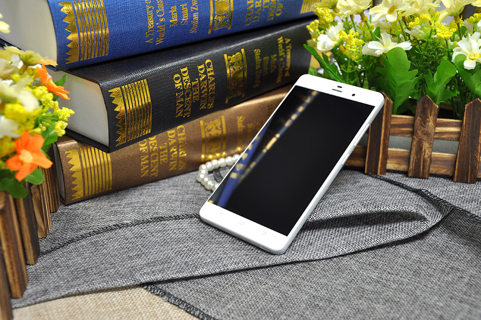 纽曼 纽扣 CM810 移动联通双4G 双卡双待（16G ROM）指纹手机 白色