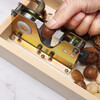 Jingle nut opener artifact walnut macadamia nut fresh raw macadamia nut clip shell opener fruit opener clip old model can adjust the size small box