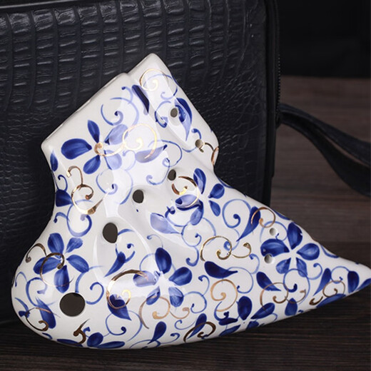 Taiwan tng ovale douze trous Mid-tone C ovale bleu et blanc en porcelaine or 12 trous à trois tuyaux Performance professionnelle Performance Flaste à quatre tuyaux