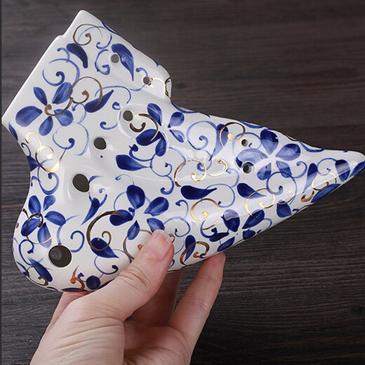Taiwan tng ovale douze trous Mid-tone C ovale bleu et blanc en porcelaine or 12 trous à trois tuyaux Performance professionnelle Performance Flaste à quatre tuyaux