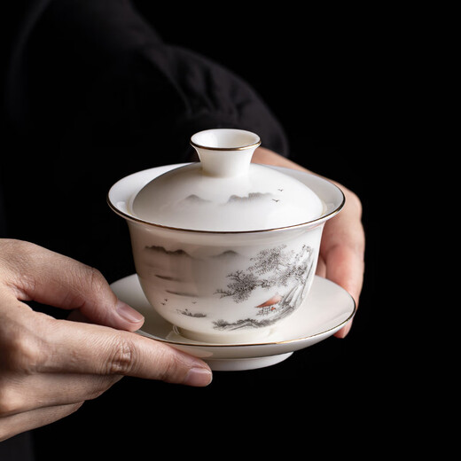 Gold inlaid jade Kung Fu tea set, complete set of home mutton fat jade porcelain drinking tea, tea gift box, high-end ink mountains and seas