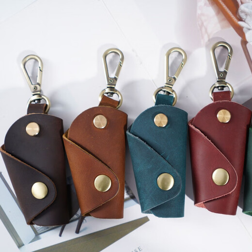 Patriot Cow (Aiguoniu) Bolsa de llave para la cadena clave de los hombres para la cintura para mujeres colgando estilo retro de cuero genuino hecho a mano Bolsa de hogar pequeño llave de hogar loco cuero creativo marrón/marrón
