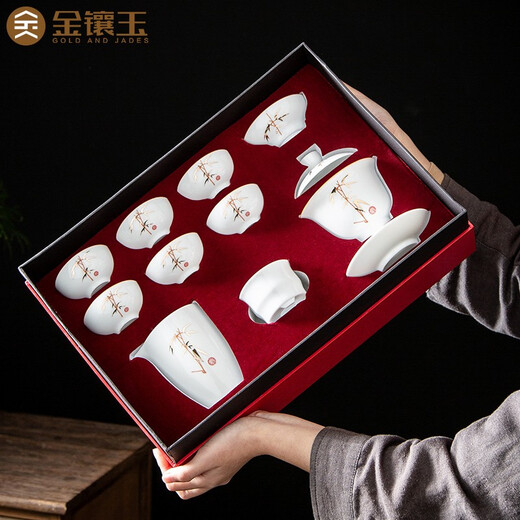 Gold inlaid jade ceramic kung fu tea set complete set of covered bowl teacup white porcelain household simple gift box high-end festival covered bowl set