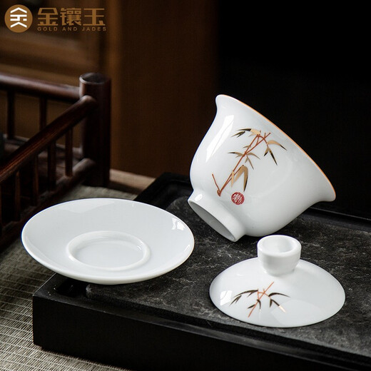 Gold inlaid jade ceramic kung fu tea set complete set of covered bowl teacup white porcelain household simple gift box high-end festival covered bowl set
