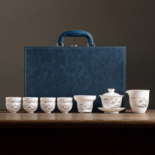 Gold inlaid jade Kung Fu tea set, complete set of home mutton fat jade porcelain drinking tea, tea gift box, high-end ink mountains and seas