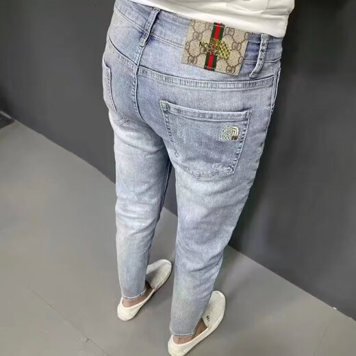 Jeans bordados de moda xcfreht Manteneros bordados Pantalones de pies delgados de estilo coreano para hombres de color