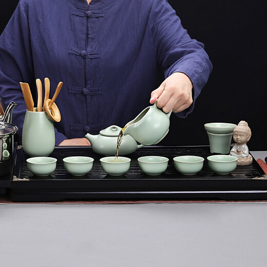 Gold inlaid jade Kung Fu tea set with solid wood tea tray for home office fully automatic water boiling electric tea stove elegant stone ladle