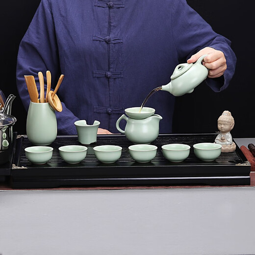 Gold inlaid jade Kung Fu tea set with solid wood tea tray for home office fully automatic water boiling electric tea stove elegant stone ladle