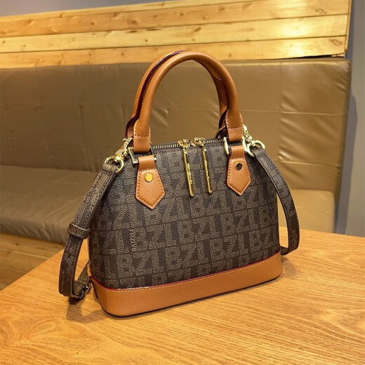 Baizili Light Luxury Brand Genuine Leather Shell Bag 2025 NUEVA Fashion One-Ho-Ho-Ho-Hohor Crossbody Bolsos Versátiles de mujer Versátil Color de caramelo Matitud