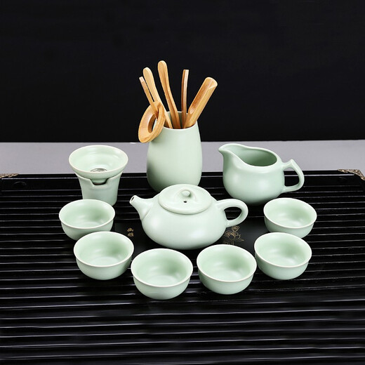 Gold inlaid jade Kung Fu tea set with solid wood tea tray for home office fully automatic water boiling electric tea stove elegant stone ladle